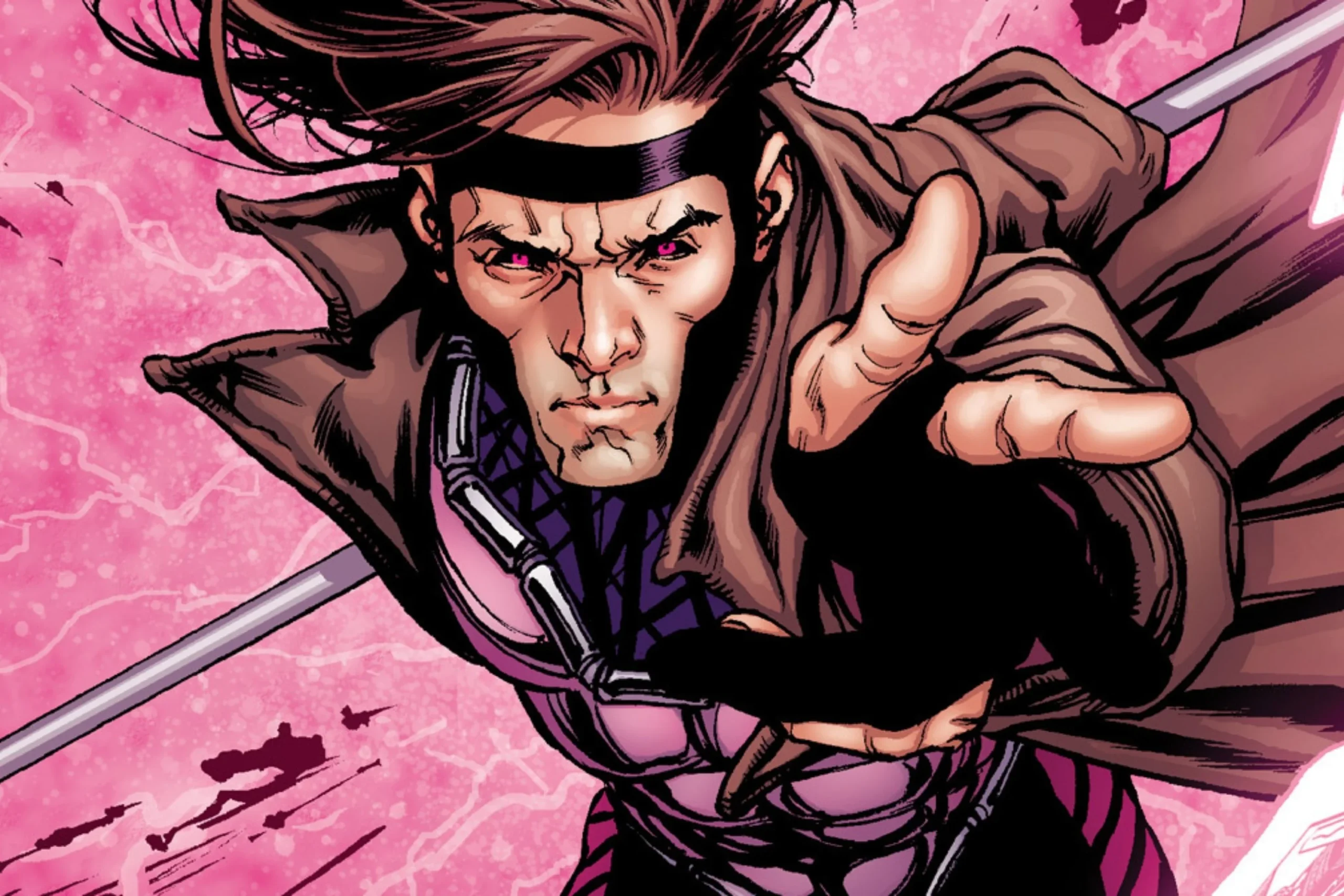 Closeup of Gambit reaching outward with intense gaze and pink lightning energy behind him.