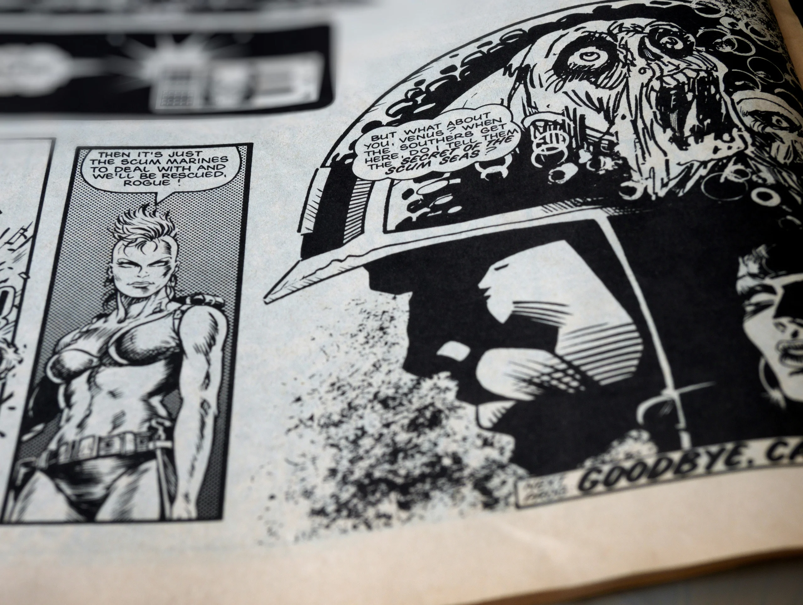 Open black-and-white comic book showing illustrated superhero panels for an article about Russia superhero comics.